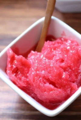 Delicious Raspberry Lemonade Sorbet served in a bowl with fresh raspberries