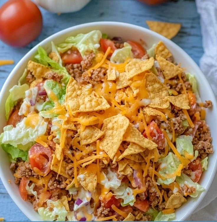 Simple Doritos Taco Salad with colorful toppings and Doritos chips