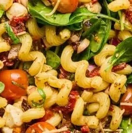 Sun Dried Tomato Pasta Salad with vibrant ingredients in a bowl