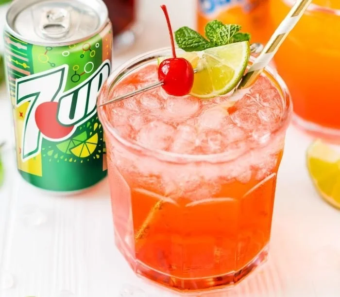 A refreshing 4-ingredient mocktail served in a glass with garnishes.