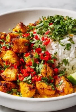 Coconut Chicken Rice Bowl with vibrant vegetables and herbs