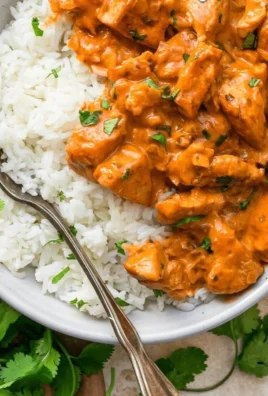 Delicious Coconut Chicken Rice Bowl topped with fresh herbs and served in a bowl