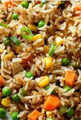 Bowl of easy fried rice with colorful vegetables and eggs
