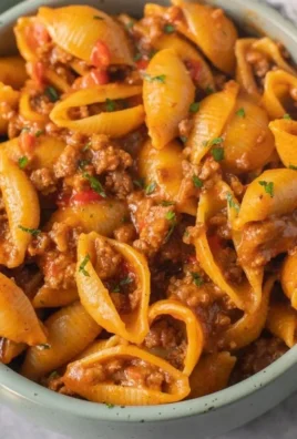 High Protein Taco Pasta with colorful ingredients in a bowl.