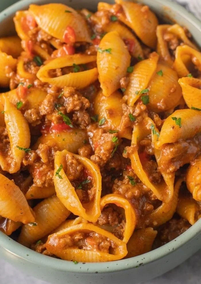 High Protein Taco Pasta with colorful ingredients in a bowl.
