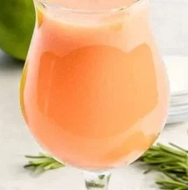 A refreshing glass of Peach Fresh Water garnished with fresh peach slices.