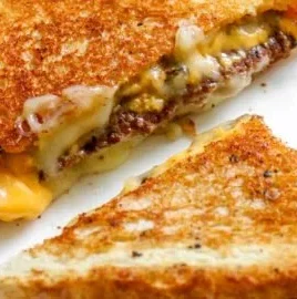 Smashburger Grilled Cheese with special sauce served on a plate