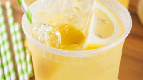 Refreshing State Fair Lemonade served in a cup at a summer fair.