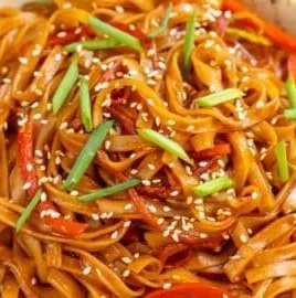 Delicious sweet and spicy Korean Gochujang noodles garnished and ready to serve