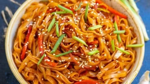 Delicious sweet and spicy Korean Gochujang noodles garnished and ready to serve