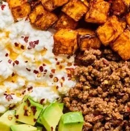 High-protein cottage cheese taco bowl topped with fresh ingredients.