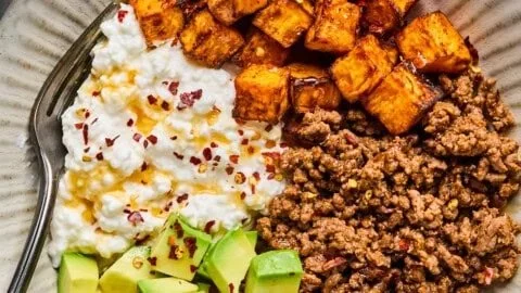 High-protein cottage cheese taco bowl topped with fresh ingredients.