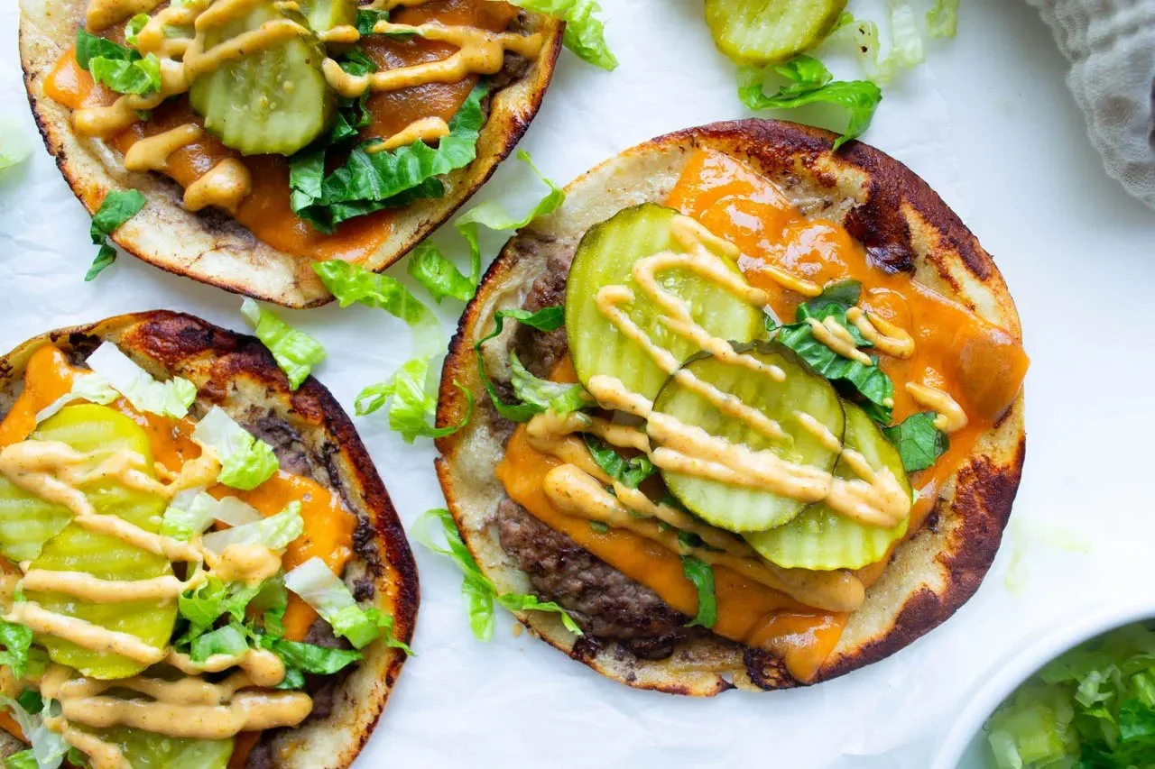 Viral smash burger tacos topped with secret sauce and fresh ingredients.