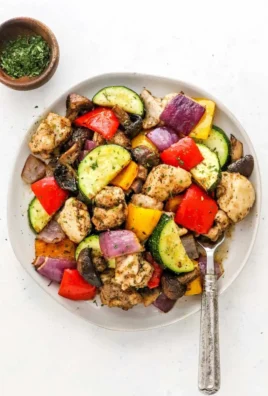 Delicious air fryer roasted chicken with fresh vegetables in a quick meal