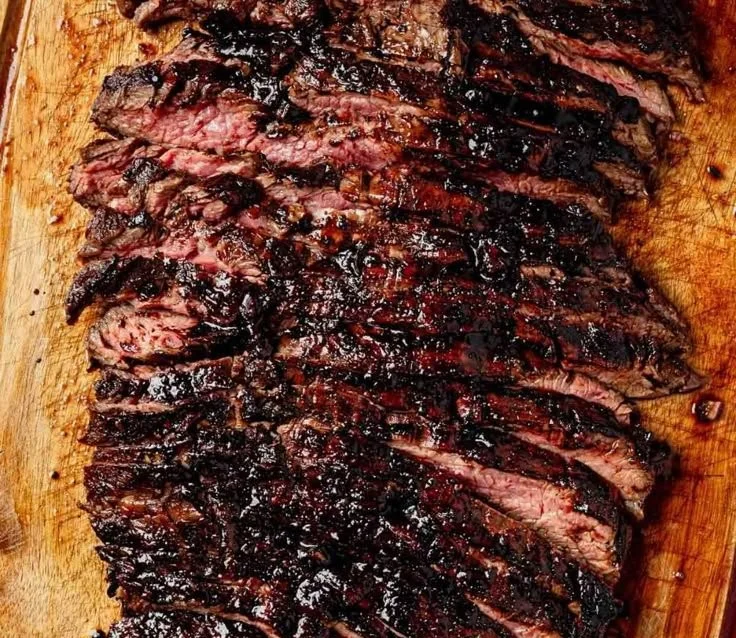 Balsamic flank steak served with grilled zucchini and whipped feta cheese