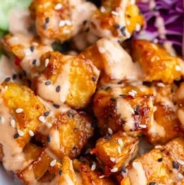 Crispy Bang Bang Tofu served with spicy sauce and fresh veggies
