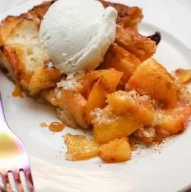 Delicious Black Folks Southern Peach Cobbler served in a rustic dish.