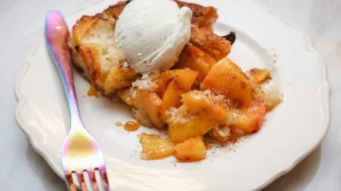 Delicious Black Folks Southern Peach Cobbler served in a rustic dish.