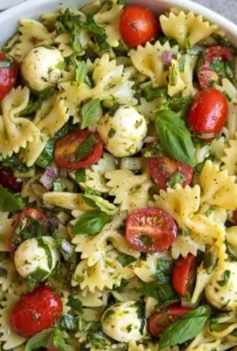 Bow Tie Pasta Salad with colorful vegetables in a serving bowl