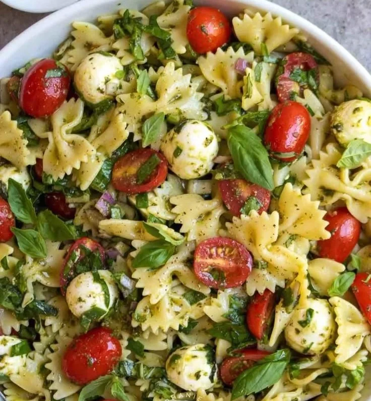 Bow Tie Pasta Salad with colorful vegetables in a serving bowl
