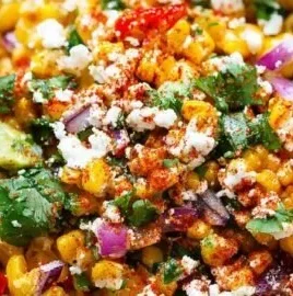 Delicious charred corn salad served in a bowl with fresh vegetables
