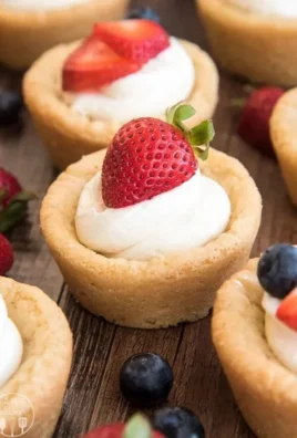 Delicious cheesecake cups with sugar cookie crusts, perfect for dessert