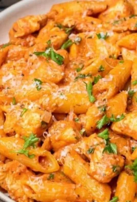 Delicious Chicken Parmesan Pasta dish with melted cheese and fresh herbs