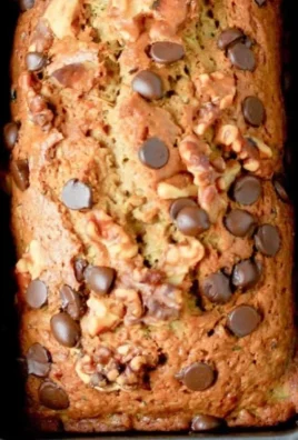 Chocolate Chip Zucchini Bread slice with chocolate chips and zucchini visible