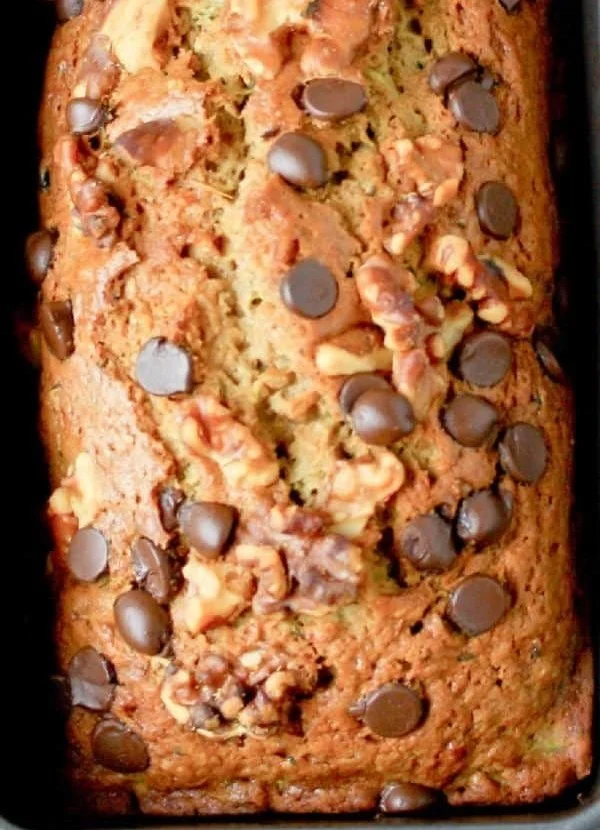 Chocolate Chip Zucchini Bread slice with chocolate chips and zucchini visible