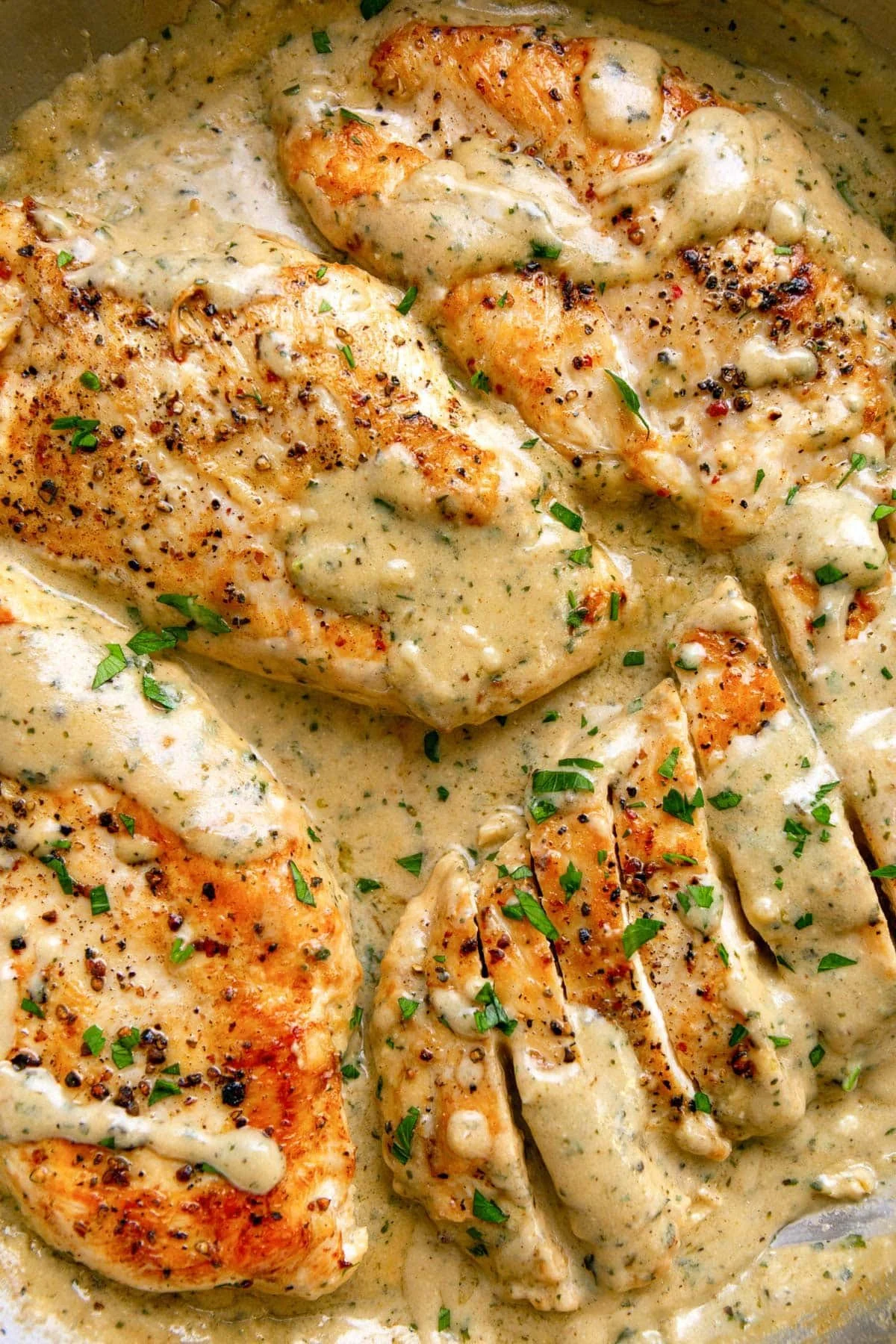 Creamy ranch chicken recipe served on a plate with herbs