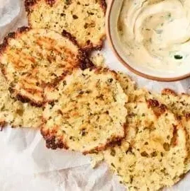 Crispy cottage cheese chips on a plate, a healthy snack option.
