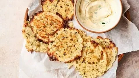 Crispy cottage cheese chips on a plate, a healthy snack option.