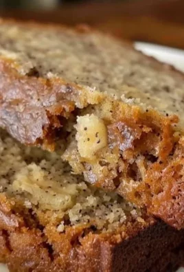 Slice of easy homemade banana bread on a wooden cutting board
