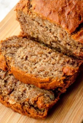 Loaf of easy homemade banana bread on a wooden table