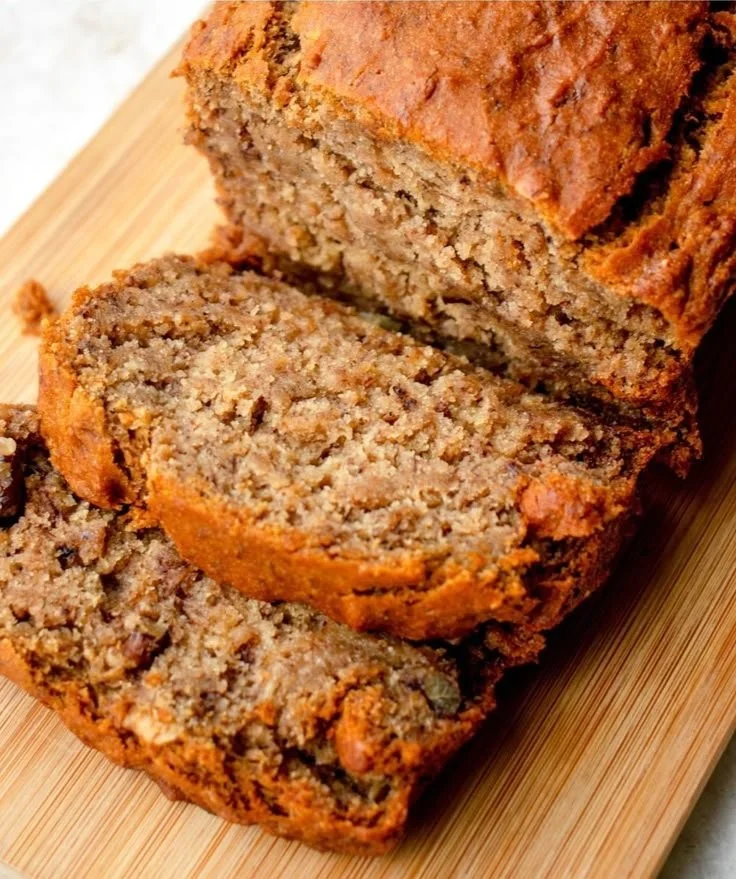 Loaf of easy homemade banana bread on a wooden table