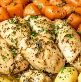 Easy Crockpot garlic herb chicken with fresh veggies in a slow cooker