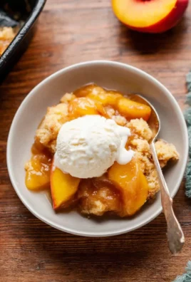 Delicious homemade fresh peach cobbler baked to perfection