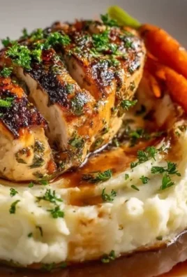 Delicious Garlic Herb Chicken garnished with fresh herbs and garlic