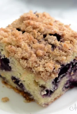 Gluten-Free Blueberry Coffee Cake topped with fresh blueberries and a crumbly topping