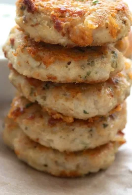 Gluten-free chicken fritters served on a plate with dipping sauce.