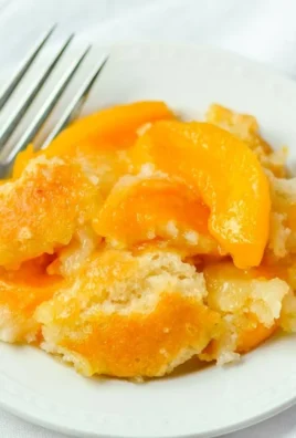 Delicious gluten-free peach cobbler dessert with fresh peaches and crispy topping