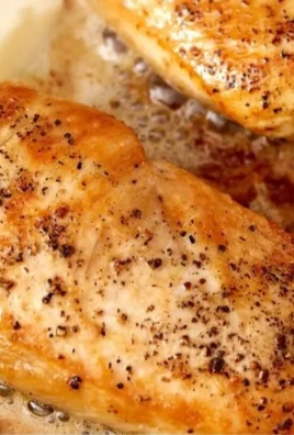 Golden and juicy chicken breast cooked to perfection on a plate