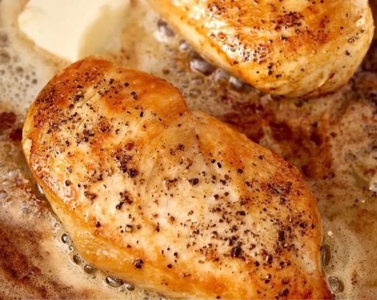 Golden and juicy chicken breast cooked to perfection on a plate