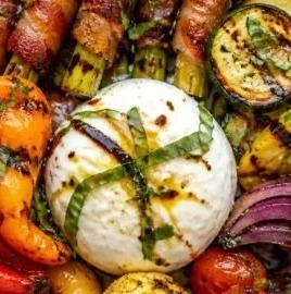 A vibrant grilled vegetable platter featuring assorted colorful vegetables