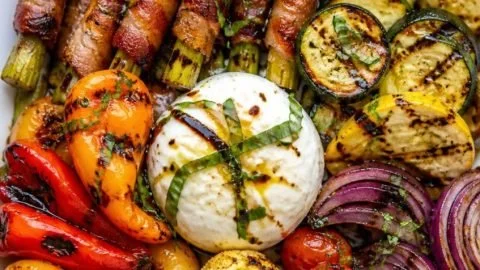 A vibrant grilled vegetable platter featuring assorted colorful vegetables