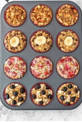 A batch of freshly baked healthy oatmeal muffins on a wooden table.