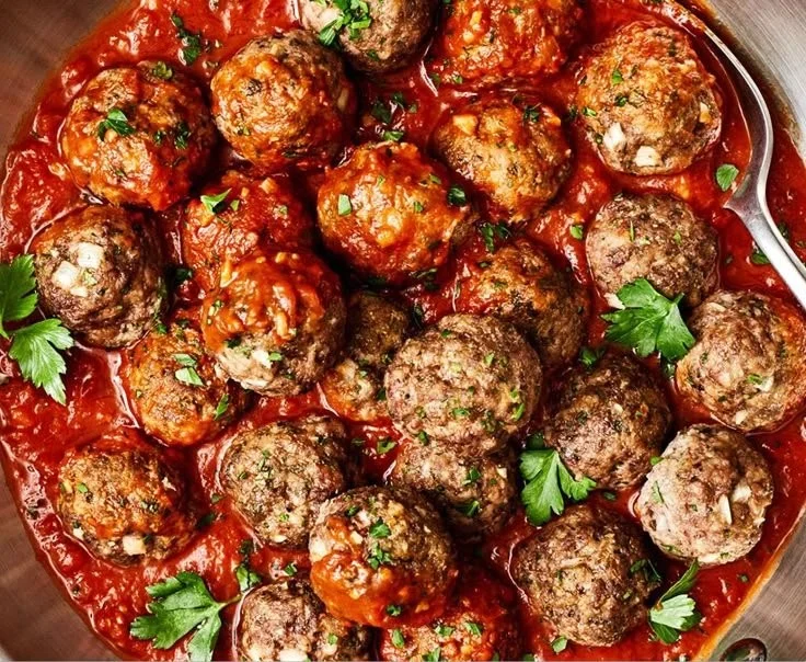 Plate of homemade gluten-free meatballs with herbs