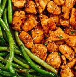 Plate of Honey Garlic Chicken served with fresh green beans