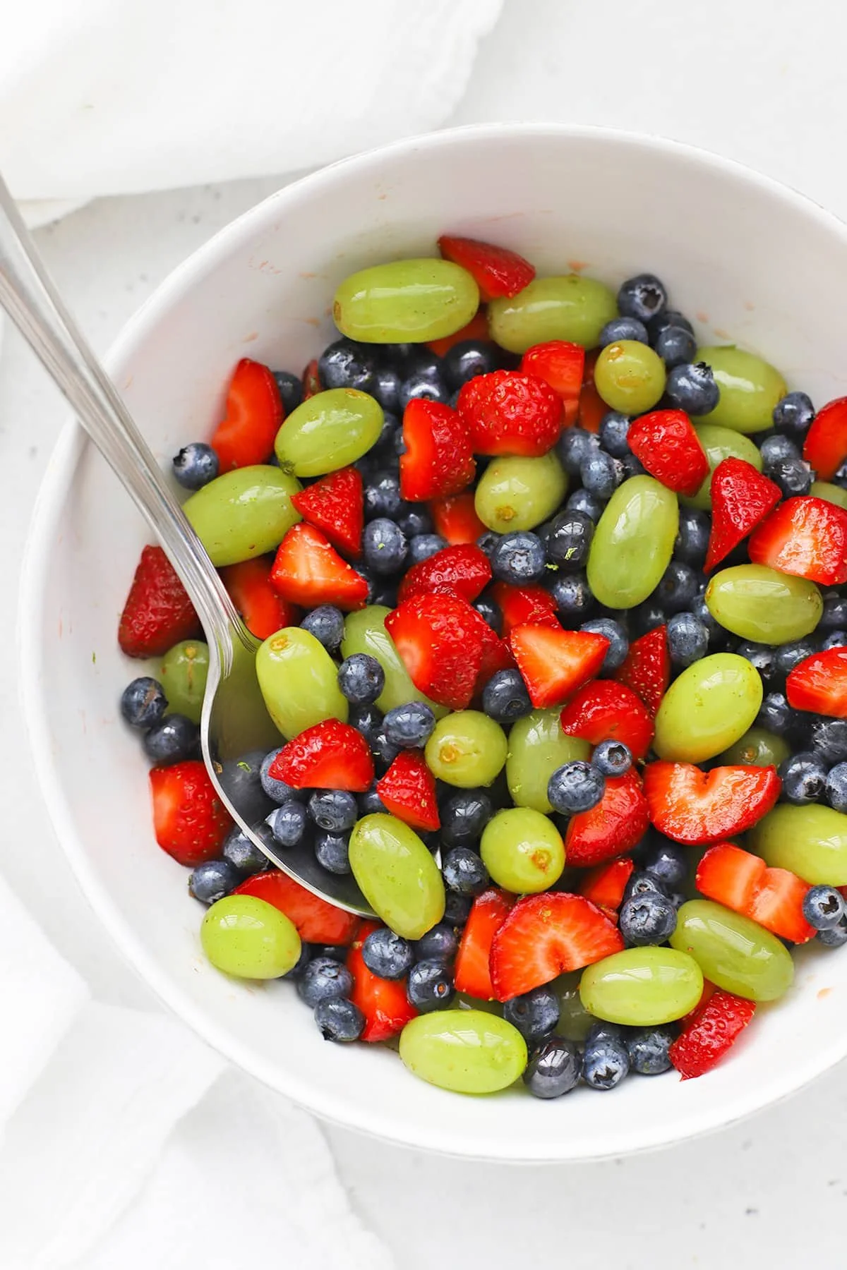 Delicious honey lime fruit salad showcasing fresh fruits in a vibrant bowl.