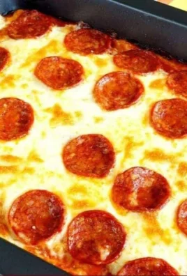Keto Pizza Casserole baked and garnished with cheese and pepperoni
